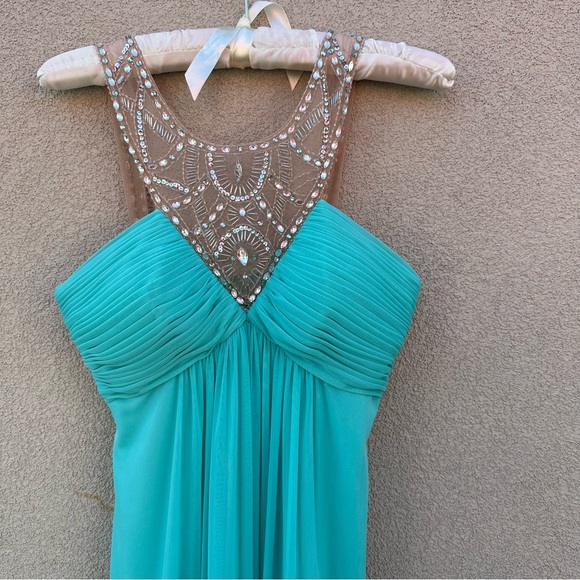 Beautiful long dress
In Aqua blue. - Picture 5 of 7